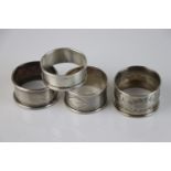 Four silver napkin rings, various makers, one with monogram (4)