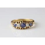 Late Victorian sapphire and diamond five stone 18ct yellow gold ring, three graduated small round