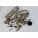 A collection of fully hallmarked sterling silver to include a brush and mirror set and a cruet set.