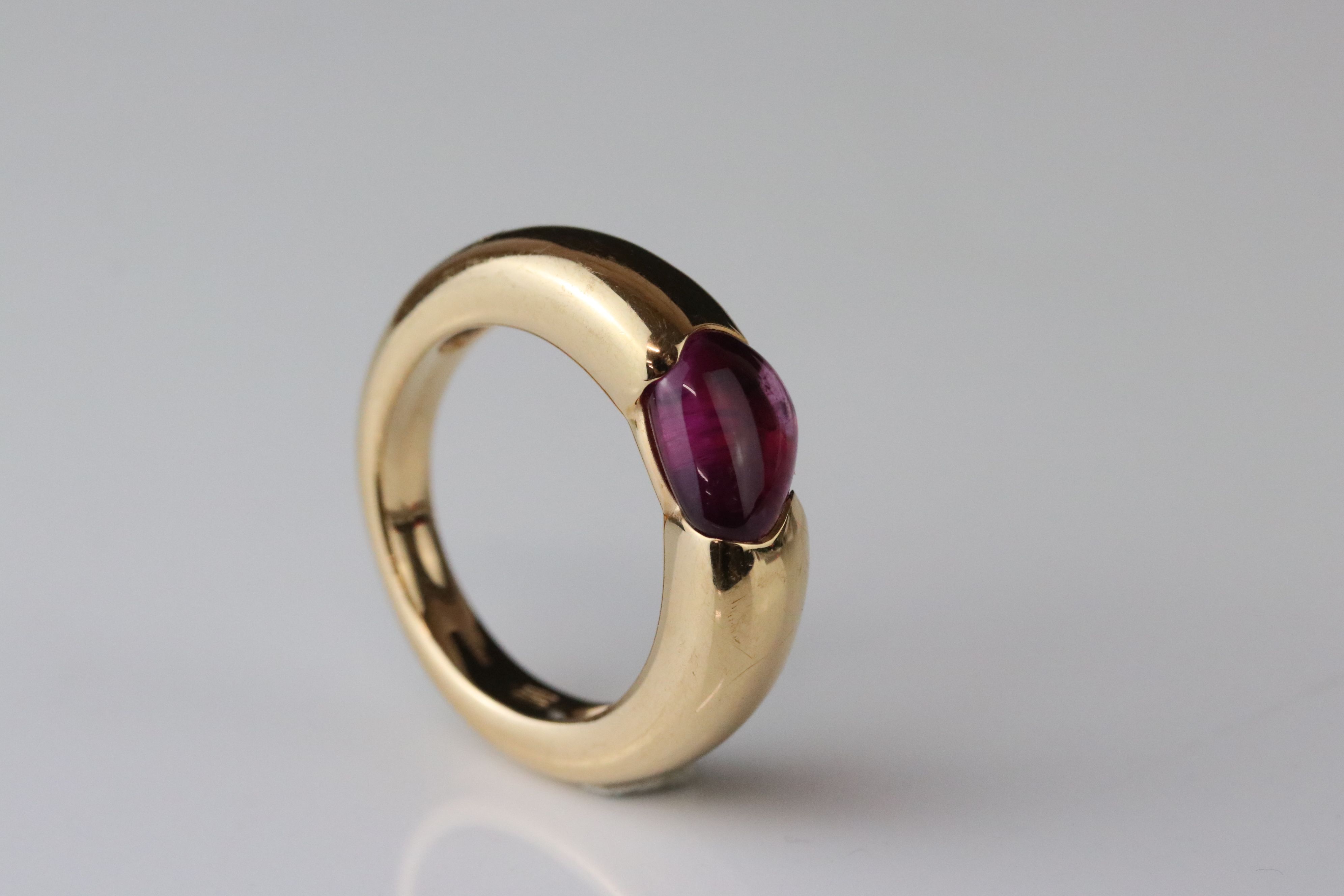 Pomellato tourmaline 18ct yellow gold ring, the cabochon cut asymmetric pink tourmaline measuring