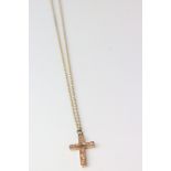 9ct rose gold cross pendant with engraved foliate decoration on later 9ct gold chain, replacement