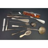 A group of mixed collectables to include a hallmarked sterling silver topped comb, button hook and