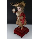 Late 19th / Early 20th century Musical Automaton in the form of a Doll powdering her face, with a