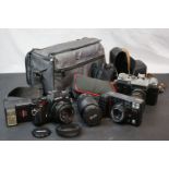A box of 35mm cameras and accessories to include a Zenith and a Miranda MS-1 Super.