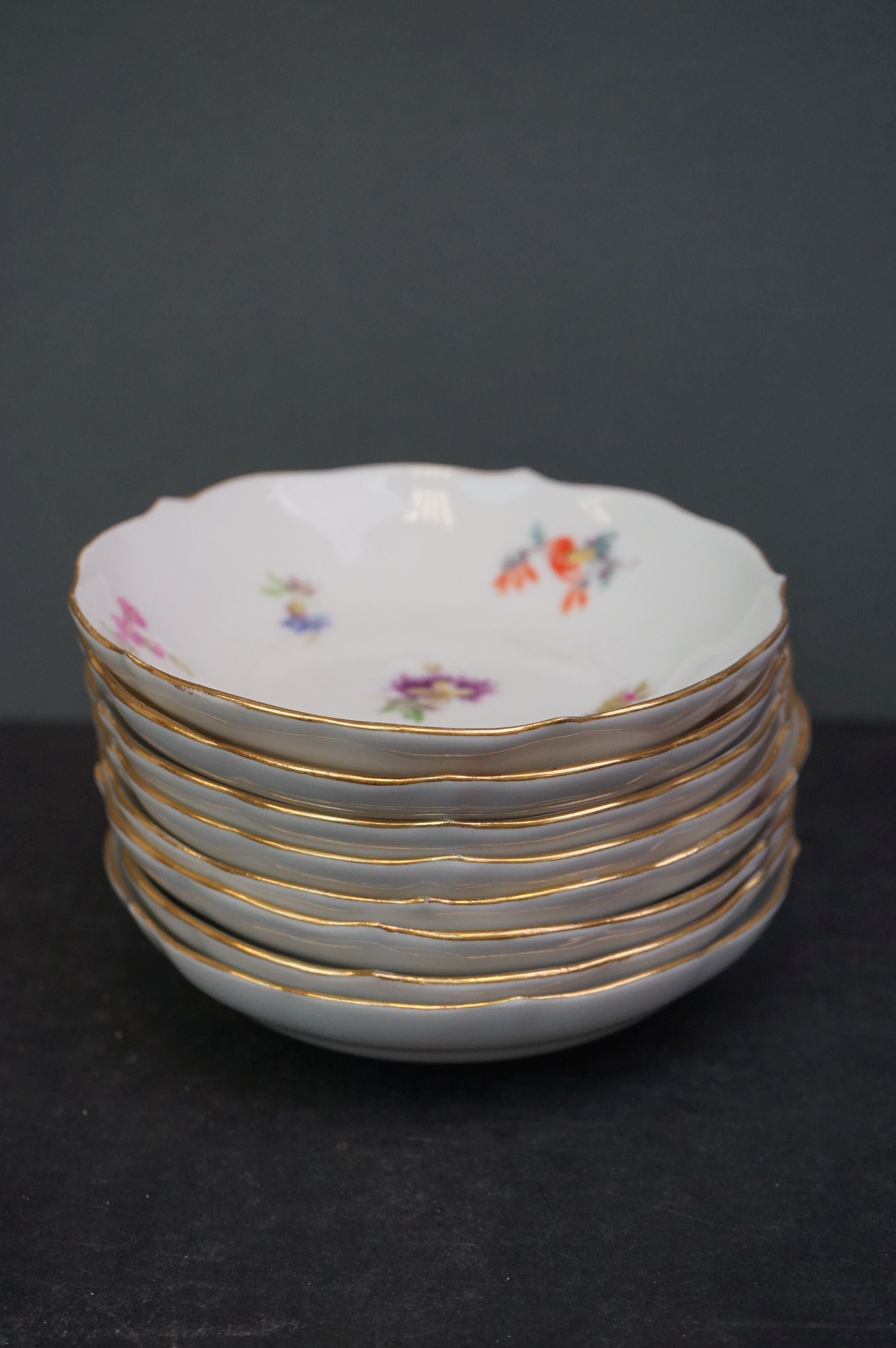 A collection of Meissen and Dresden porcelain to include plates, cups and dishes. - Image 10 of 13