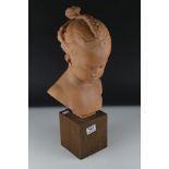 After Jacques Saly, Terracotta effect Bust of a Young Girl titled ' The little girl with braided