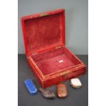 A red leather box with royal cypher containing a leather cased etui, a cased cheroot case with pug