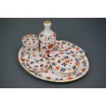 A Royal Crown Derby style dressing table set with floral decoration number 260 to underside.