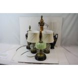 A group of five ceramic table lamps together with an oil lamp base.