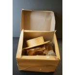 A cardboard hat box containing Two vintage hats straw boaters together with a Tricky designer hat by