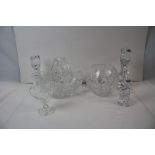 A collection of crystal cut glass to include vases and candlesticks.