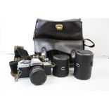 A Minolta XG2 35mm camera with bag & accessories.