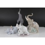 Lladro Bisque Elephant together with another Lladro Elephant and Two Nao Elephants, tallest 27cms