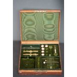 A vintage gents jewellery box with contents to include 18ct gold and enamel studs and cravat pins.