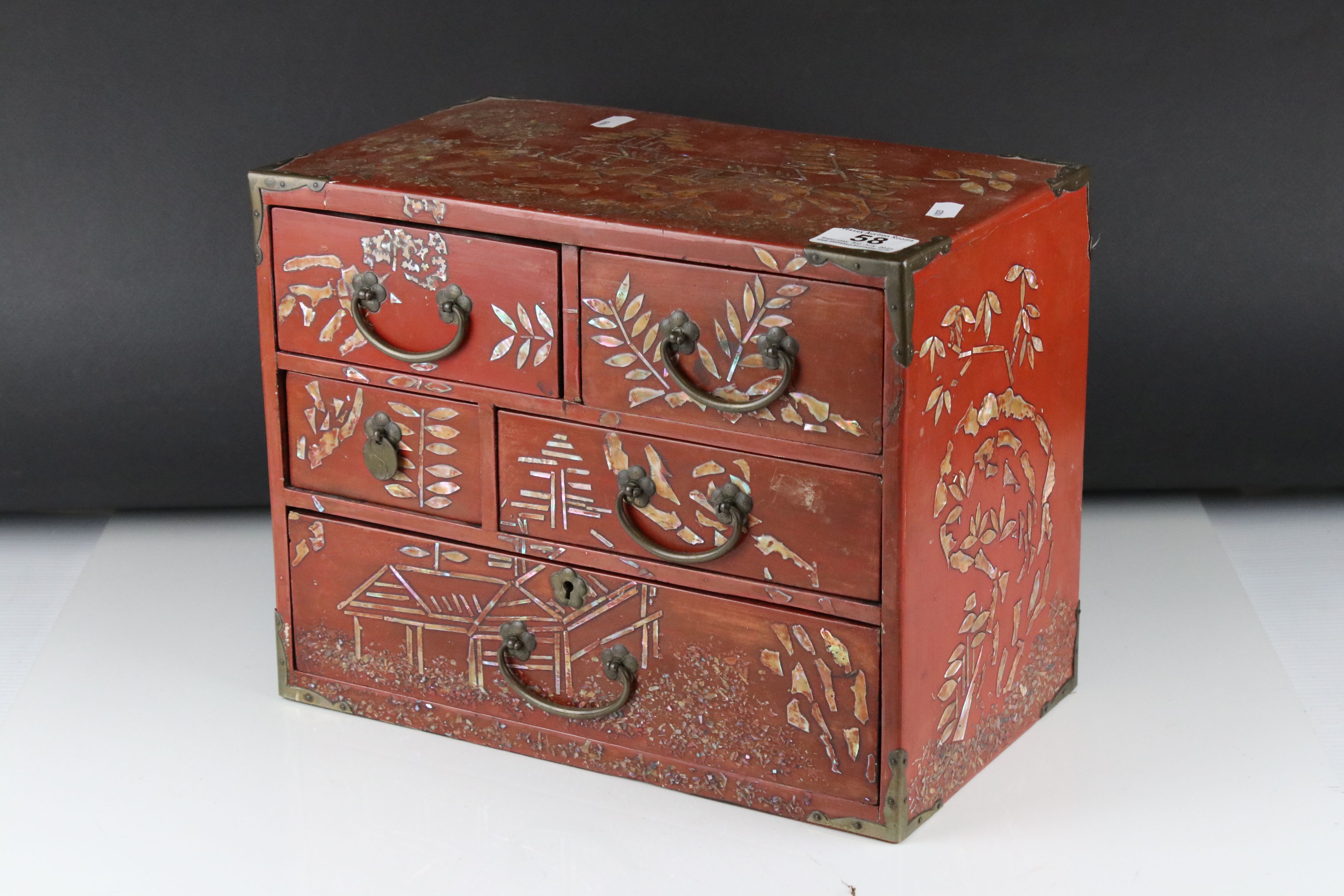 Japanese Red Lacquer and Brass Bound Table Top Cabinet with mother of pearl style decoration,