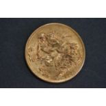 A King George V gold Full Sovereign coin.