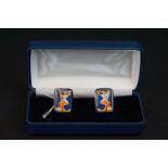 Pair of sterling silver and enamel cufflinks, depicting a lady in a 1940s/50s style glamour pose