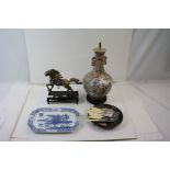 A decorative metal horse ornament on wooden base together with a Chinese lamp and a quantity of
