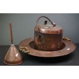 A collection of copper items to include a lidded pot, a funnel and a large dish with brass handles.