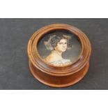 A Portrait miniature mounted in a wooden box.