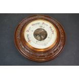 A early 20th century circular wall hanging barometer.