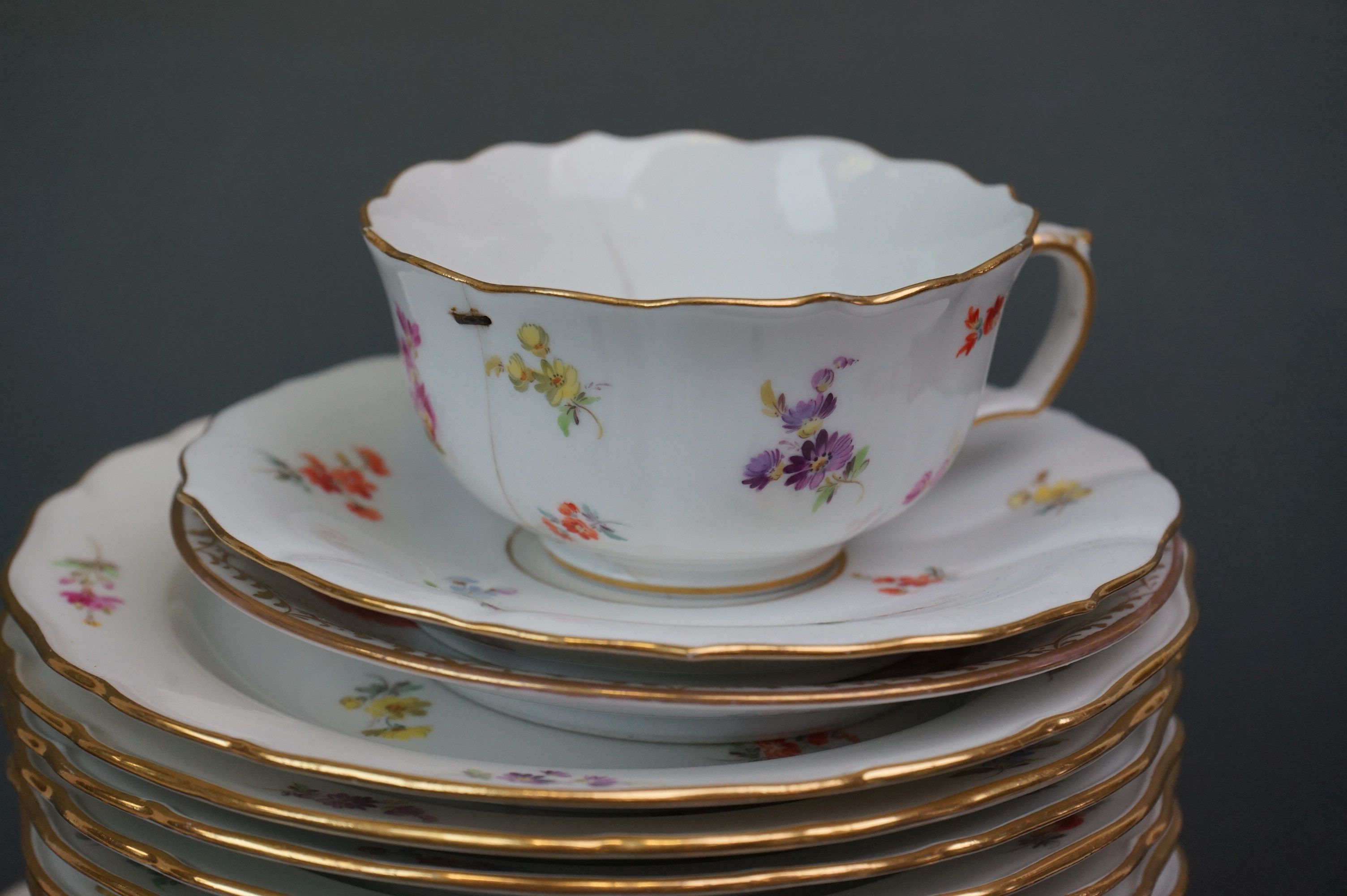 A collection of Meissen and Dresden porcelain to include plates, cups and dishes. - Image 7 of 13