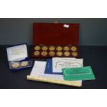 A cased Danbury Mint fully hallmarked silver gilt ingots featuring the arms of the Prince of Wales