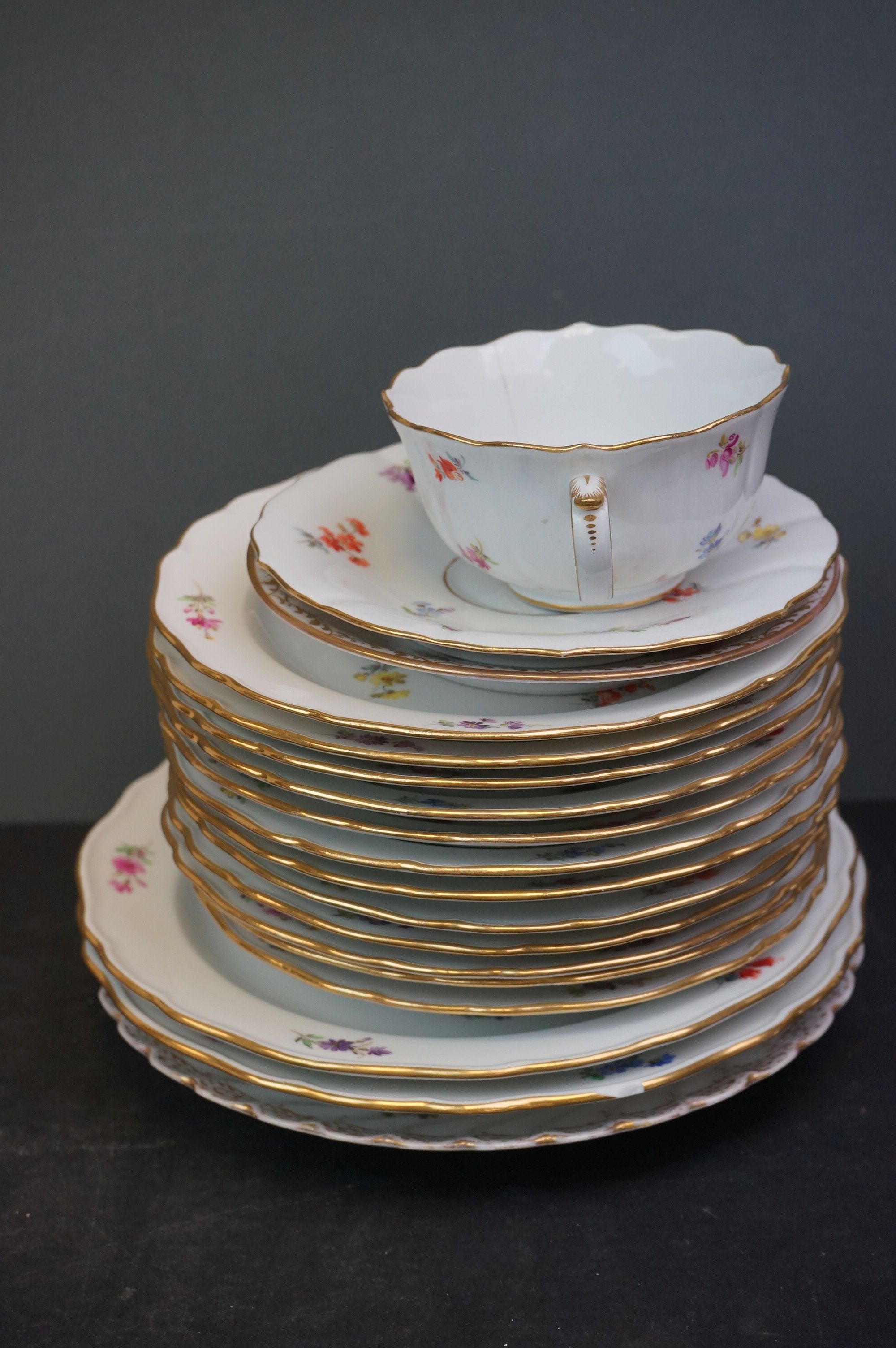 A collection of Meissen and Dresden porcelain to include plates, cups and dishes. - Image 5 of 13