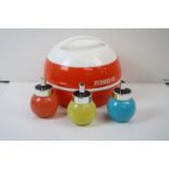 A retro Pernod 45 ice bucket together with three coloured glass sugar dispensers.
