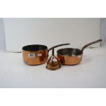 Two copper saucepans together with a copper sieve.