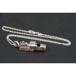 Silver whistle, in the form of a train, on a silver chain