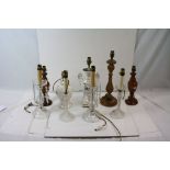 A collection of nine vintage table lamps to include glass, wood and ceramic examples.