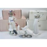 A collection of four boxed Nao ceramic ornaments to include Female figures and geese.