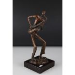 A contemporary Bronze saxophonist 24 cm tall.