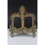 Large antique brass double picture frame with Rococo style decoration, reg no. 444517