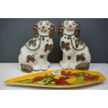 A 1970s Poole Pottery Delphis pattern dish together with a pair of lustre Staffordshire dogs.
