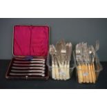 A cased set of hallmarked silver handled butter knives together with two sets of silver plated