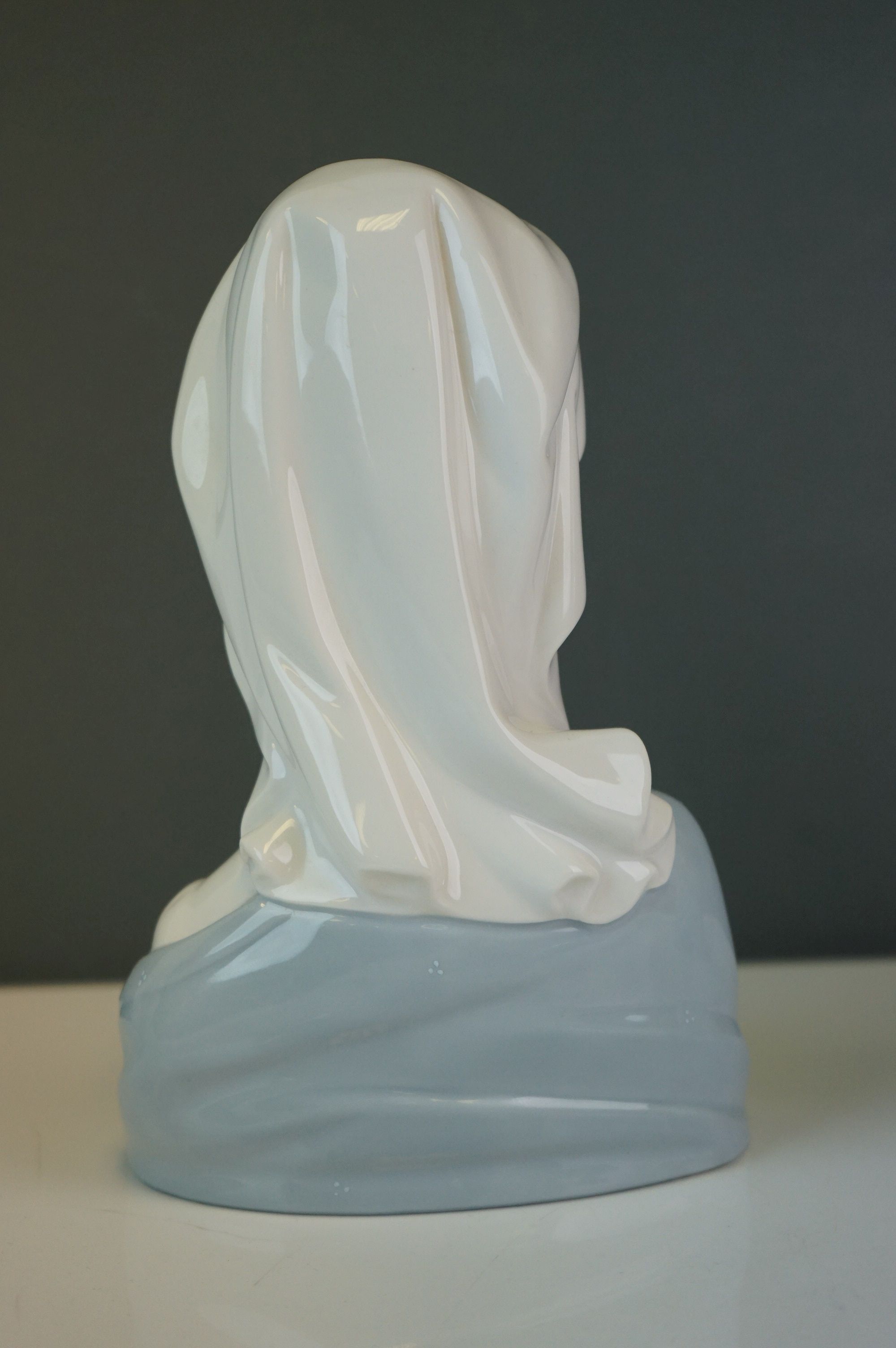 A Lladro bust of a woman in a cowl, together with a girl holding a hen (2) - Image 4 of 9