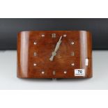 Art Deco Wall Hanging Wind Up Clock contained in a Carved oak case, 30cms long