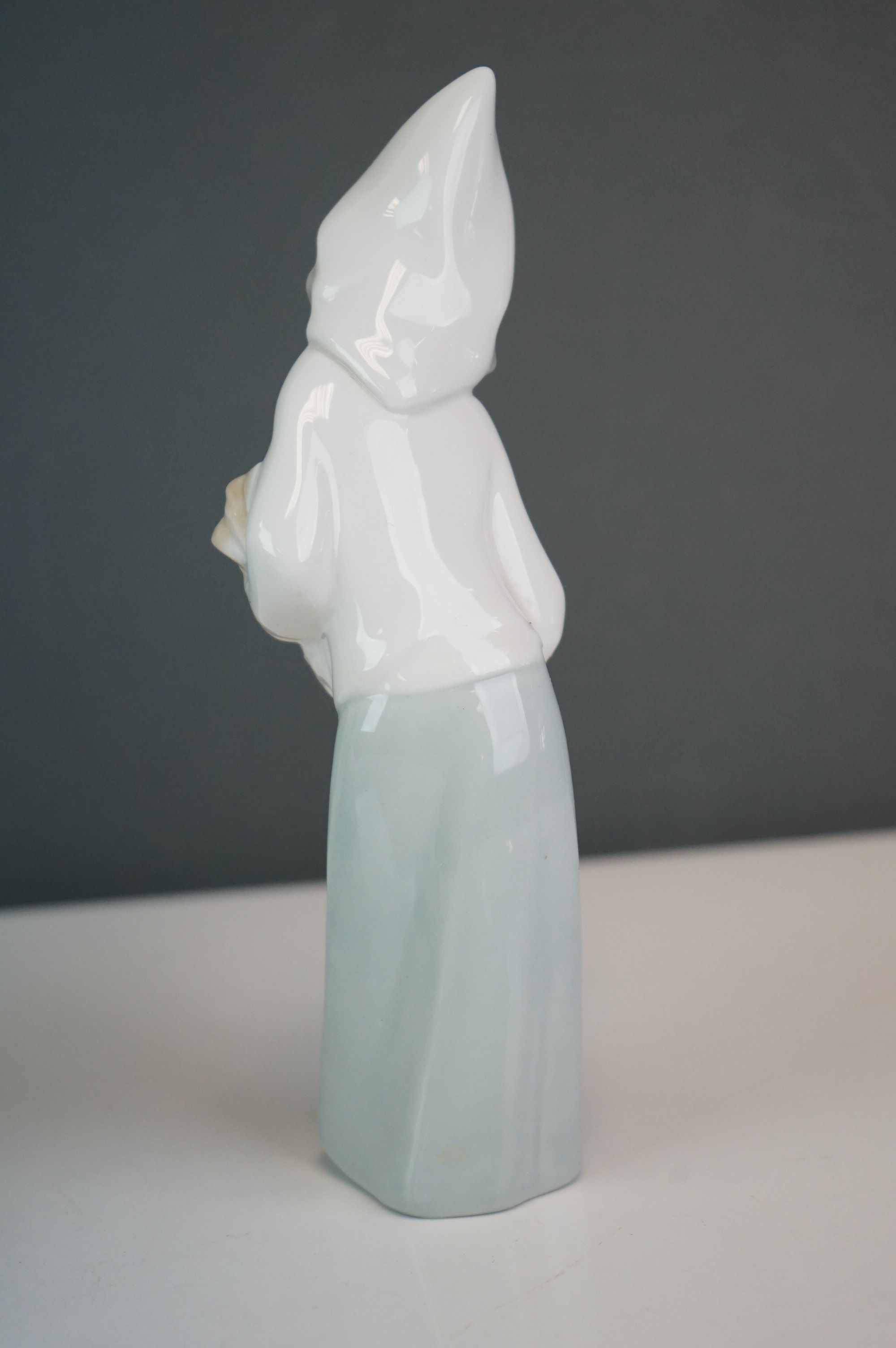 A Lladro bust of a woman in a cowl, together with a girl holding a hen (2) - Image 8 of 9