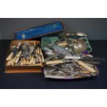 A large quantity of silver plated cutlery to include Asparagus tongs, gravy spoons and serving