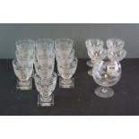 A quantity of antique glasses to include a set of cut glass wine glasses with grapevine decoration