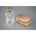 A fully hallmarked 9ct gold topped brush and cologne bottle set, maker marked for William Neale &