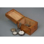 A collection of three silver cased pocket watches together with a selection of Albert chains.
