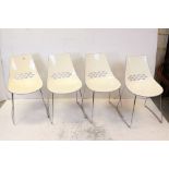 Set of Four Contemporary Italian Designer Style White Plastic Dining Chairs raised on chrome legs,