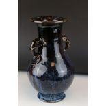 18th century Chinese Vase with Sang de Bouef glazing and two elephant handles, 35cms high