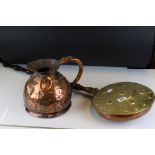 A vintage brass Bed warmer together with a copper gallon jug