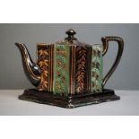 Victorian china Staffordshire 'Jackfield' tea pot on stand