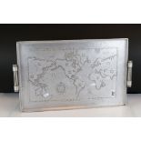 A vintage aluminium serving tray decorated with a map of the world.