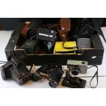 A collection of cameras and binoculars to include Brownies and a Warwick No.2.